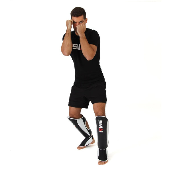 SMAI Essentials Muay Thai Shin Guards (pair) front view on foot