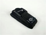 Introducing Sale Item's Yoga Strap: a black coiled nylon strap equipped with a plastic buckle and metal clasp, perfect for securing or tightening various items. Its adjustable length offers great versatility, and it is neatly folded against a simple white backdrop.
