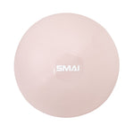 The SMAI Pilates Ball - Clay Pink is a pale pink, round ball with a white "SMAI" logo at the center, shown from above on a white background—perfect for core strengthening and Pilates workouts.