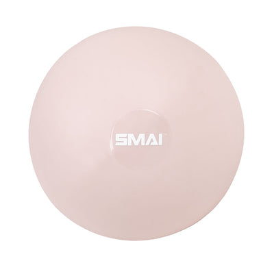 The SMAI Pilates Ball - Clay Pink is a pale pink, round ball with a white "SMAI" logo at the center, shown from above on a white background—perfect for core strengthening and Pilates workouts.