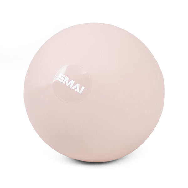 The SMAI Pilates Ball - Clay Pink features a light pink hue and white SMAI logo, ideal for core strengthening in any Pilates workout, displayed on a plain white background.