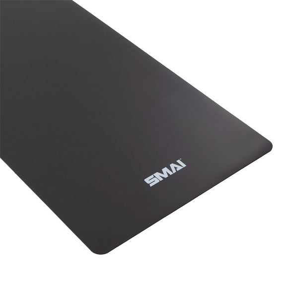 Detail of logo on a dark grey yoga mat / pilates mat SMAI rubber workout mat 