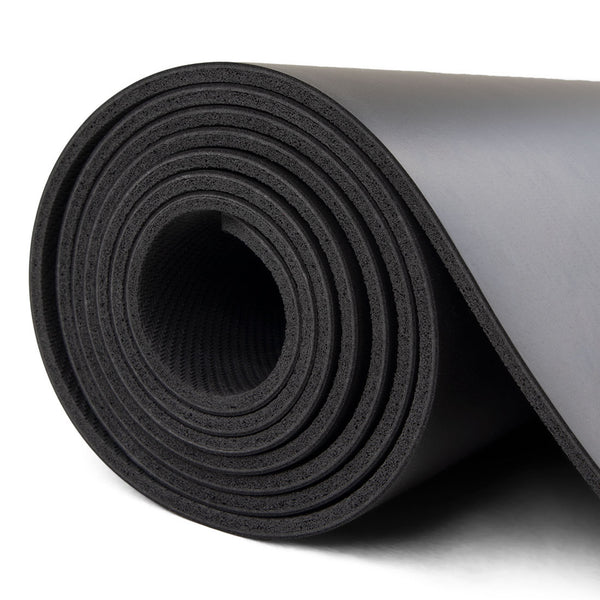 side view of rolled up dark grey yoga mat / pilates mat SMAI rubber workout mat 