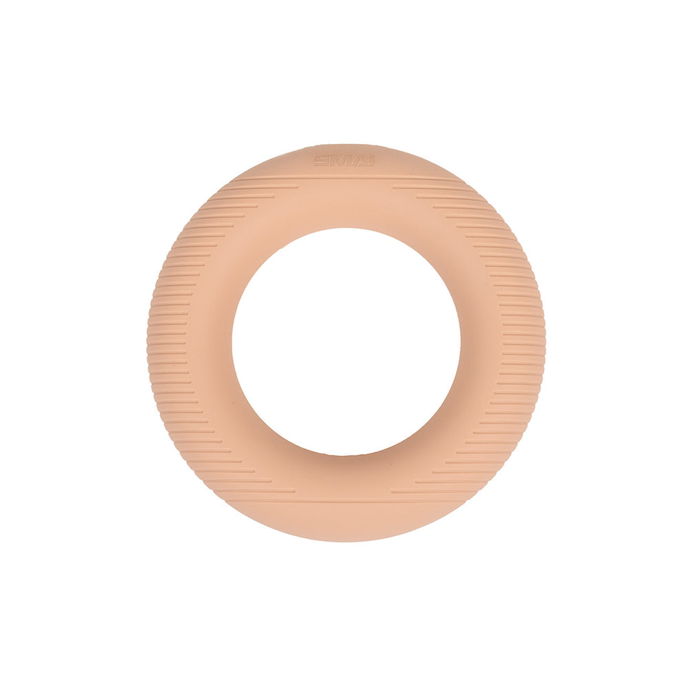 The SMAI Pilates Power Ring in Blush Pink (2.5kg) is a round silicone fitness accessory with a smooth inner side and textured outer edge, pictured on a white background.