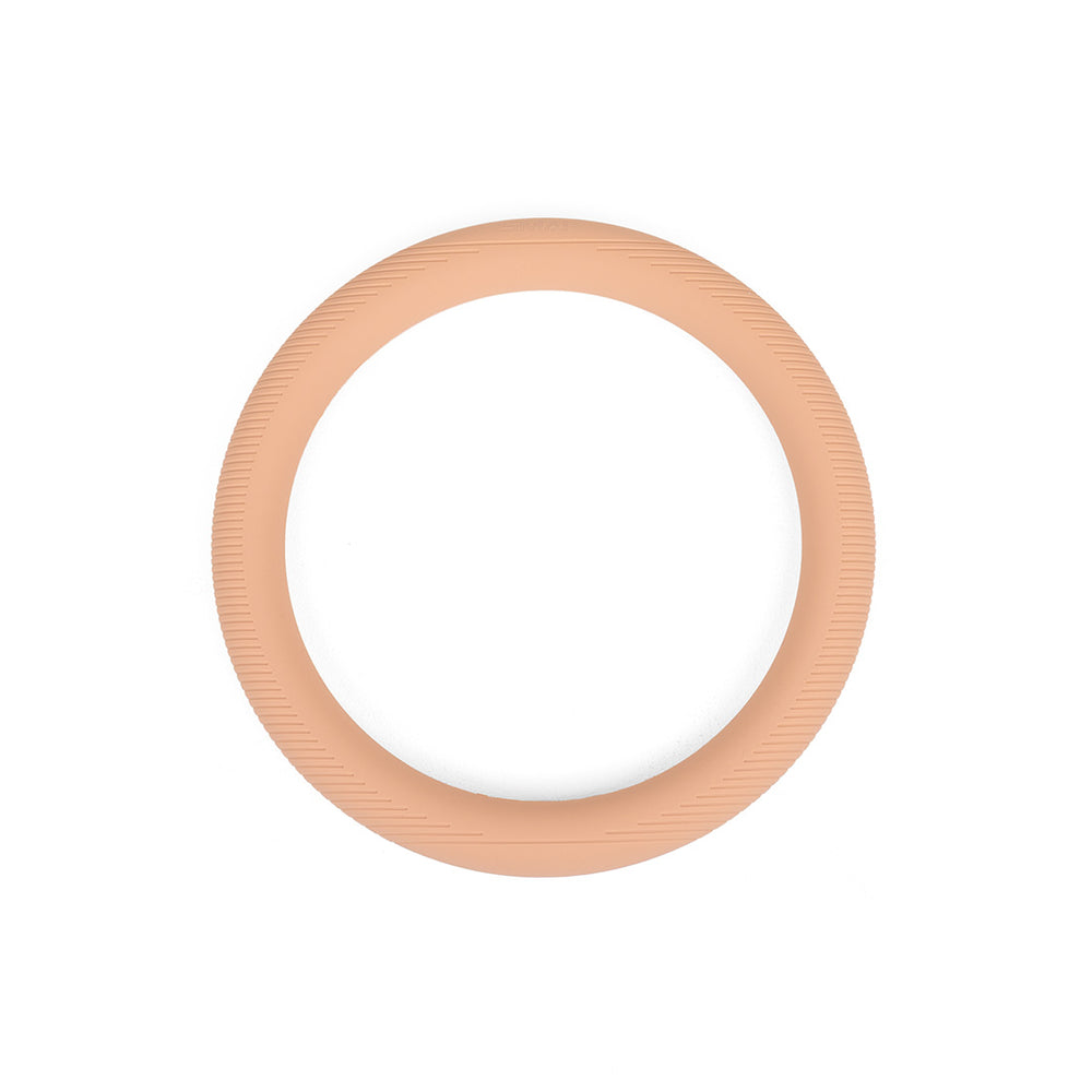 The SMAI Pilates Power Ring Blush Pink 4.5kg is a silicone-covered fitness ring in blush pink, featuring subtle textured lines along its outer edge, displayed against a white background.