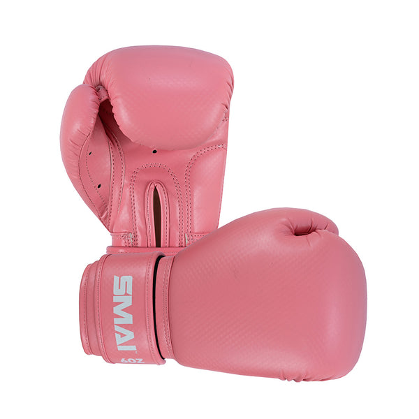 The SMAI PRE ORDER: Essentials Kids Boxing Glove - Pink features smooth synthetic leather and a white logo on the wrist strap, with one glove upright and the other lying flat for added style and durability.