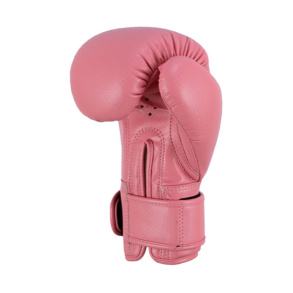 The SMAI PRE ORDER: Essentials Kids Boxing Glove - Pink features synthetic leather, a supportive fastened wrist strap, and an inward-curved thumb, shown standing upright on a white background.