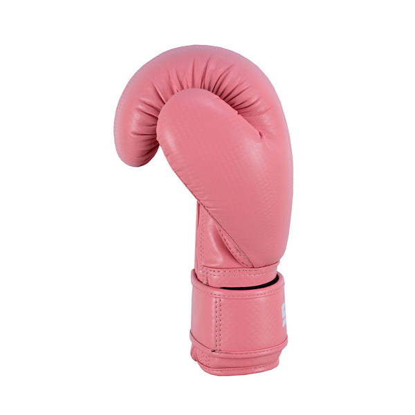 The SMAI PRE ORDER: Essentials Kids Boxing Glove in pink features synthetic leather and a Velcro strap for wrist support, shown upright on a white background.