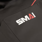 Close-up of a black Replacement Cover - Plyometric Box - Pre-Assembled by SMAI, featuring the white and red SMAI logo; the "A" is highlighted in red, designed to fit your SMAI Plyometric Box.