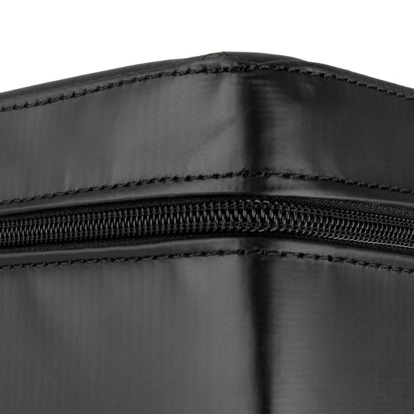 Close-up of a black, rectangular SMAI WOD Box Pro Foam Plyo Box (20"/24"/30"), showing visible stitching and a horizontal zipper on the side. The smooth, slightly shiny material is typical of competition-grade plyometric boxes from SMAI.