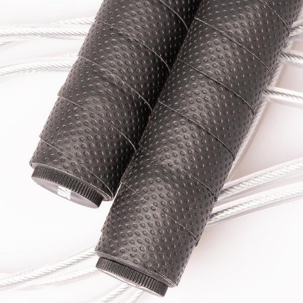 Two textured, weighted handles for the SMAI Skipping Rope with Weighted Handles, shown with silver cables.