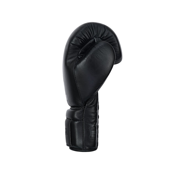 The SMAI Pro Series Leather Lace-Up Boxing Glove in black stands upright against a white background, displaying its side profile and lace-up wrist strap for secure fit and optimal impact absorption.