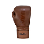 The SMAI Pro Series Leather Lace-Up Boxing Glove in antique brown is displayed upright against a white background, featuring the brand name on the wrist and designed for premium impact absorption.