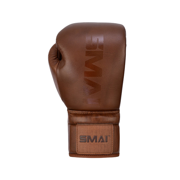 The SMAI Pro Series Leather Lace-Up Boxing Glove in antique brown is displayed upright against a white background, featuring the brand name on the wrist and designed for premium impact absorption.