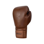 The SMAI Pro Series Leather Lace-Up Boxing Glove in Antique Brown features visible stitching and the "SMAI" logo on the wrist strap, crafted from premium cowhide leather and displayed against a plain white background.