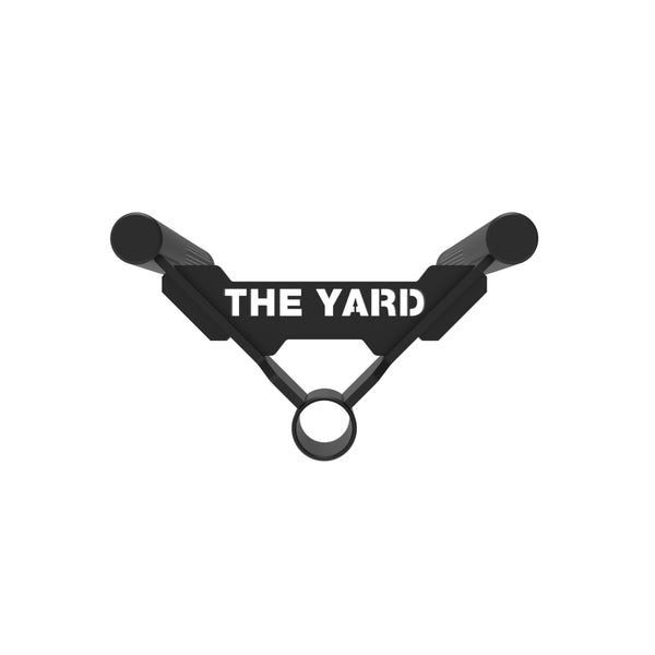 The Yard - Core Trainer / Landmine Parallel Row Handle by SMAI features two grips and a centered ring, with "THE YARD" in bold white on the connecting bar, shown on a white background.