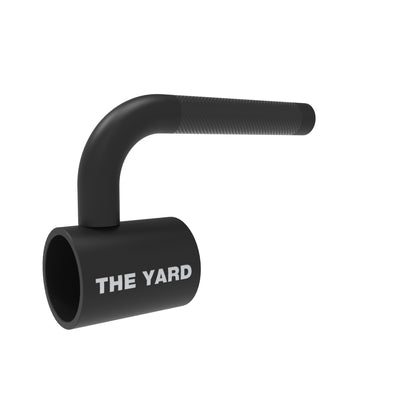 The SMAI The Yard - Single Barbell Handle is a black, cylindrical metal landmine accessory with a textured grip and "THE YARD" printed in white. Its right-angle bend makes it a versatile core trainer for strength workouts.
