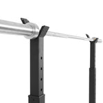 A close-up of the SMAI Portable Squat Stand - Heavy Duty with a metallic barbell, featuring adjustable holders—ideal for any home gym—set against a plain white background.