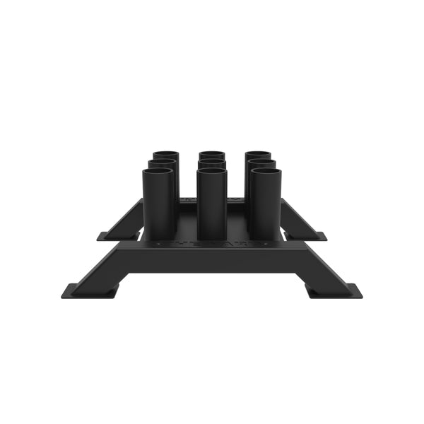 The SMAI The Yard - Barbell Storage - 9 Freestanding is a black rectangular metal rack with four wide-legged supports and nine cylindrical holders in two rows, featuring a minimalist industrial design for Olympic barbell storage.