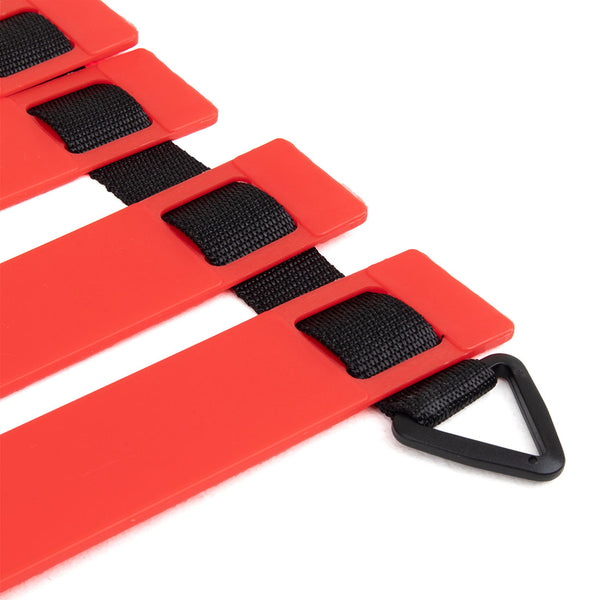 Close-up of the ATHLIV Agility Ladder by Sale Item, featuring a striking red design with black straps and a triangular black clip. The horizontal ladder rungs of this essential training tool are perfect for fitness exercises aimed at enhancing speed and athletic performance.