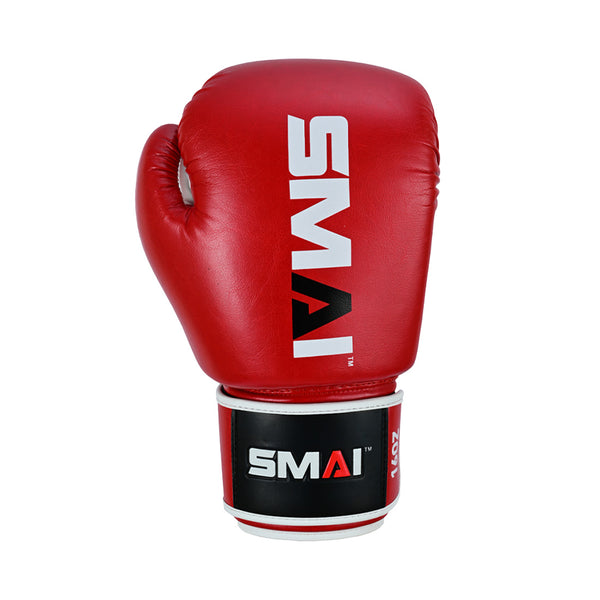 The Essentials Red Boxing Glove by SMAI features the brand's white logo and is shown upright against a plain white background.
