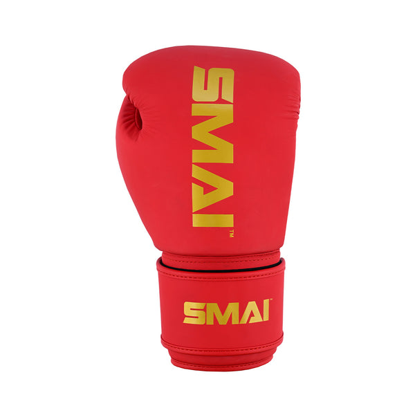 The SMAI Gold Series Boxing Glove - Red/Gold is shown upright against a white background, featuring bold yellow "SMAI" lettering and designed for superior shock protection.