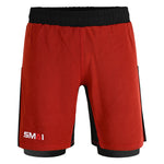 The SMAI Hybrid MMA Grappling Shorts in black/red feature a black waistband, black side panels, a white “SMAI” logo on the front left leg, and a fitted underlayer at the hem for comfort during tough training.