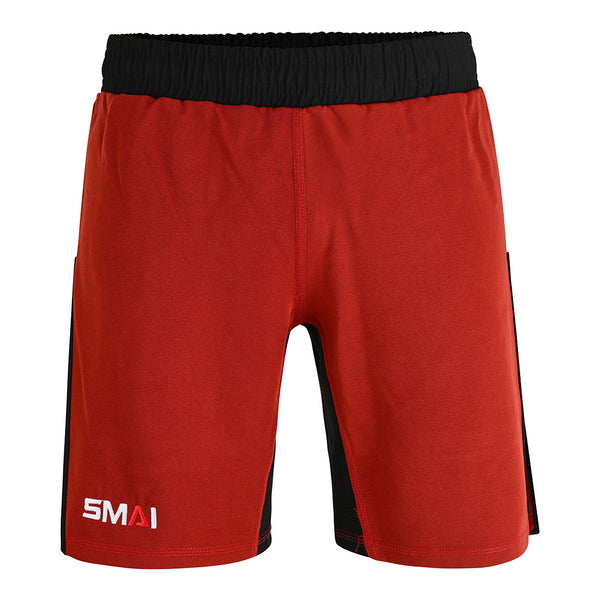 The SMAI Hybrid MMA Grappling Shorts in Black/Red feature a black elastic waistband, red body, side panels, and a white "SMAI" logo on the left leg. Durable and ideal for training, they're shown against a white background.