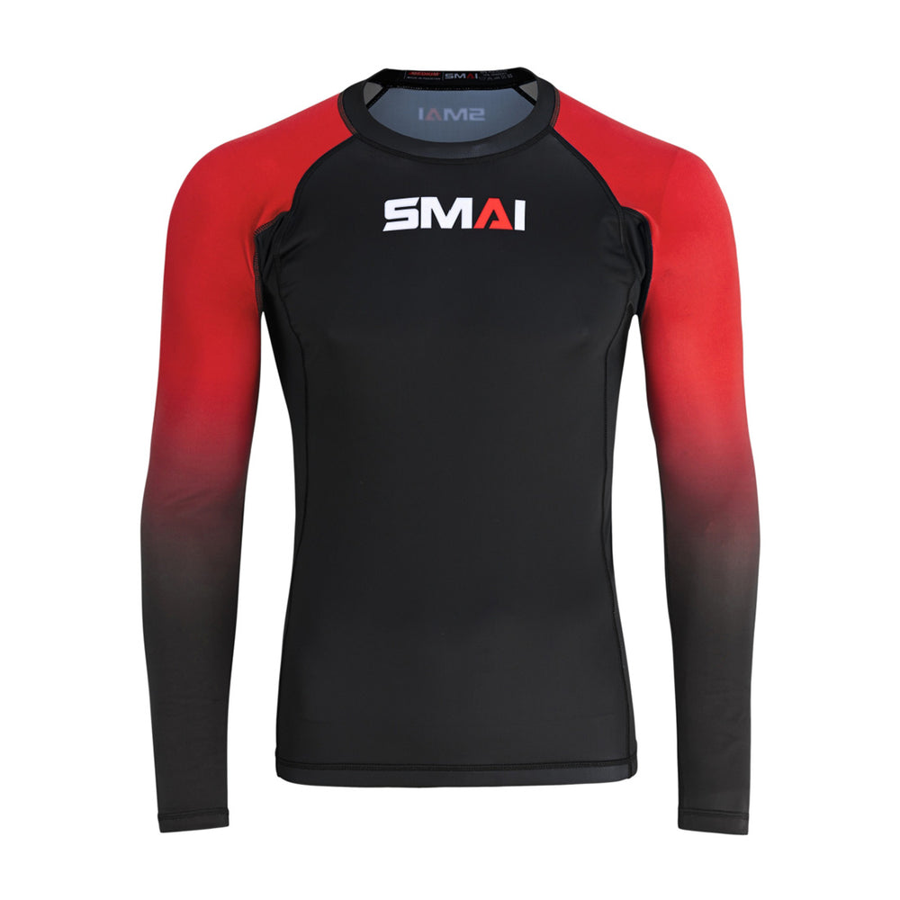 The SMAI Long Sleeve Rash Guard - Red features a black body, red and black gradient sleeves, and a white/red SMAI logo on the chest. Designed for no-gi grappling, it uses advanced compression technology.