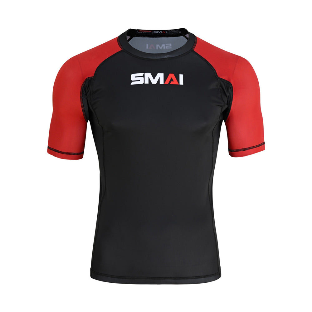 The SMAI Short Sleeve Rash Guard - Red features a black body, red sleeves, and "SMAI" printed boldly on the chest—ideal for no-gi grappling sessions.