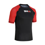 The SMAI Short Sleeve Rash Guard - Red features a black body, red sleeves, and a white "SMAI" logo on the chest. Designed for no-gi grappling, it offers advanced compression technology for optimal athletic performance.