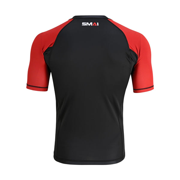 The SMAI Short Sleeve Rash Guard - Red features a black body, red sleeves, compression technology, black stitching, and a small white "SMAI" logo at the upper back near the neckline.