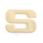 A beige, S-shaped dumbbell from the "SBELL Home Gym Package," made by No Sync To Channel Engine and labeled "4KG," rests on a white background. Featuring soft, rounded edges and an open center, it's ideal for fitness enthusiasts seeking space-saving solutions.