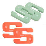 Two pairs of U-shaped dumbbells from the SBELL Advanced Pack, ideal for strength and conditioning training: one pair is green and marked as 8 kg, while the other is orange and marked as 10 kg. Each weight prominently features the SBELL brand, making them perfect for dedicated free weight training enthusiasts.