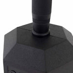 Close-up of the handle and top of a black, hexagonal dumbbell with a textured grip, like the SMAI The Yard - Rubber Hex Dumbbell 32.5kg (Pair) found among quality commercial gym equipment.