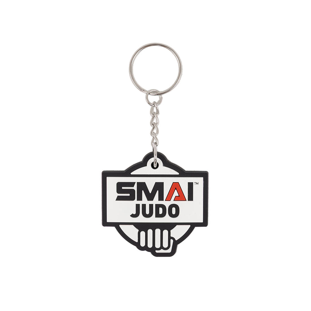The SMAI Judo Keyring - Rubber by SMAI features a rectangular rubber tag with "SMAI JUDO" in bold above a stylized hand graphic, attached to a metal ring and chain.