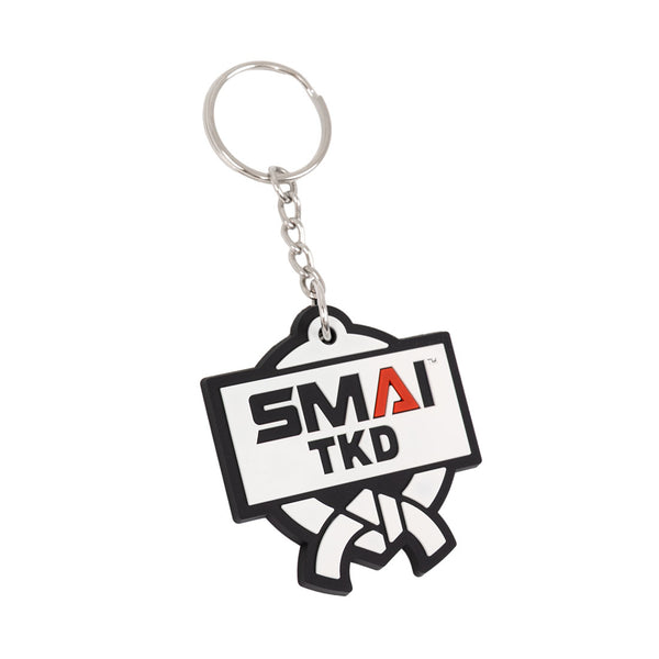 The SMAI Taekwondo Keyring - Rubber by SMAI features a metal ring and chain, with a black and white rubber tag showing "SMAI TKD" and a martial arts belt image.