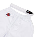 The SMAI Kin Kyokushin Uniform - 8oz Student Gi includes white martial arts pants with an elastic waistband and a small red/black embroidered patch. It features a white belt with a black/red tag, ideal for Kyokushinkai training sessions.
