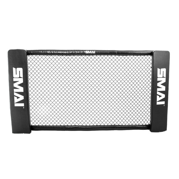 The MMA Cage Wall - Single Panel by SMAI is a rectangular training barrier with black padded sides and a central mesh screen designed to resemble an MMA cage. The name "SMAI" is prominently printed in white on the padded sides, contrasting sharply against the clean white background.