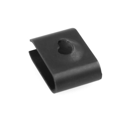 SMAI Air Fit Bike 2.0 - Fan Cage Clip A12: black metal U-clip featuring a central circular hole and a slightly raised, rounded surface, shown against a white background. This reliable spare part is designed specifically for the Air Fit 2.0 system.
