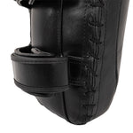Close-up of the SMAI Muay Thai Pad - Syntec Black (Pair), featuring visible stitching and two securing straps, designed as a durable strike target for martial arts or boxing training.