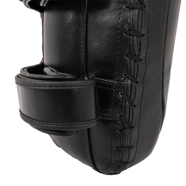 Close-up of the SMAI Muay Thai Pad - Syntec Black (Pair), featuring visible stitching and two securing straps, designed as a durable strike target for martial arts or boxing training.