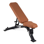 The SMAI Yard Adjustable Weight Bench – Super Bench features a brown padded seat and backrest with a sturdy black metal frame, offering commercial-grade durability, shown on a white background.