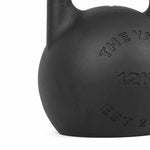 A close-up of the SMAI The Yard - Competition Steel Kettlebell 36kg, featuring custom branding and embossed details on its black surface.
