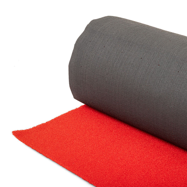 A close-up of the SMAI Red Gym Turf Sled Track (2m x 12m) shows the partially unrolled mat with a textured bright red underside and smooth dark gray top, set against a white background.