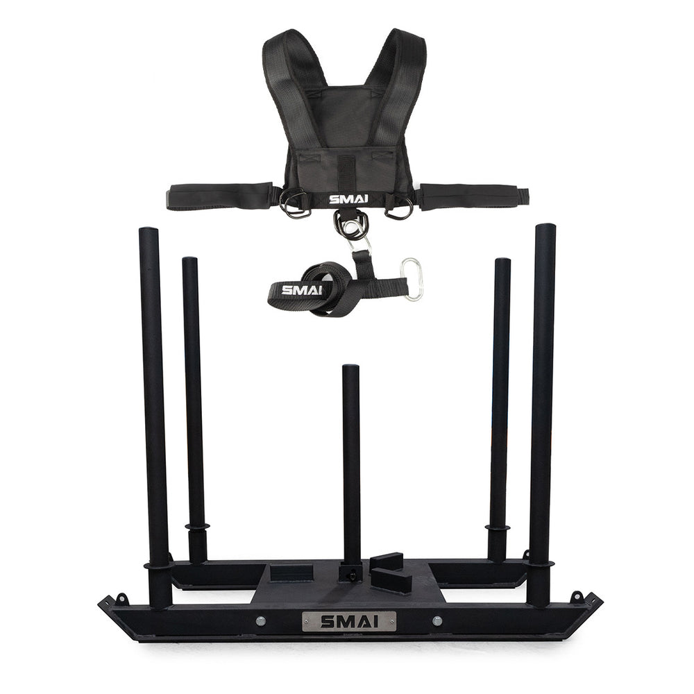 The SMAI Tower Gym Sled 3.0 With Sled Harness is a black sled featuring four vertical posts, shoulder straps, and a "SMAI" belt—ideal for strength, resistance, and sprint training.