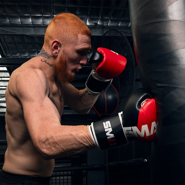 Zeke Campbell wearing the SMAI ProGuard Red Boxing Glove