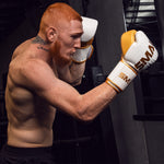Zeke Campbell using the SMAI ProGuard White/Gold Boxing Glove