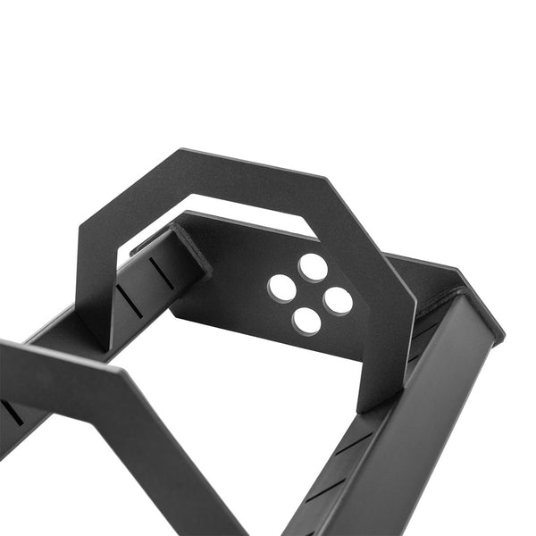Close-up of a black metal bracket with angular design and four circular holes, part of the SMAI Vanta Series Bumper Plate Toaster Storage Shelf.