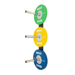 The SMAI Wall mounted Bumper Plate Storage with Chrome Pegs efficiently organizes three sets of colored weight plates—green (top), yellow (middle), and blue (bottom)—each labeled "SMAI" with their corresponding weights.